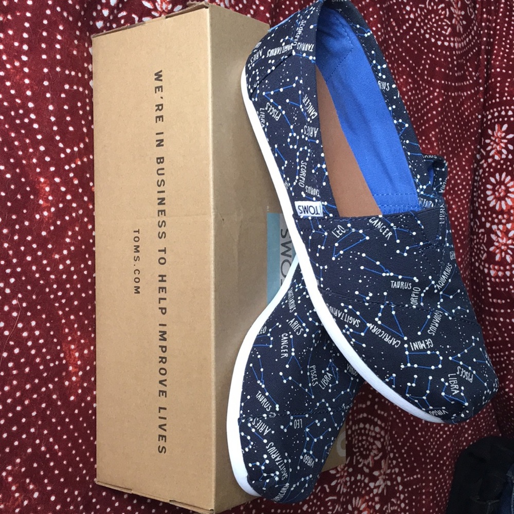 Brand new, ltd edition, glow in the dark Toms!